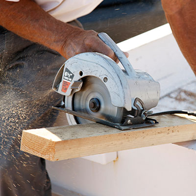 Image of Building, cutting board with a circular saw on THS Homes new development site.
